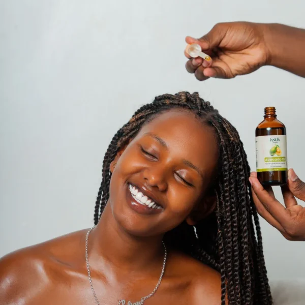 Applying Kaik Avocado Oil to hair