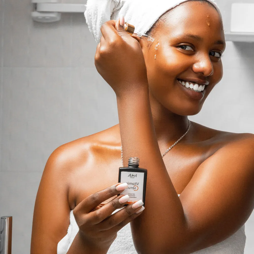Applying Kaik Vitamin Serum on face